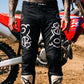 Motocross-Hose Blackout getragen auf der Strecke